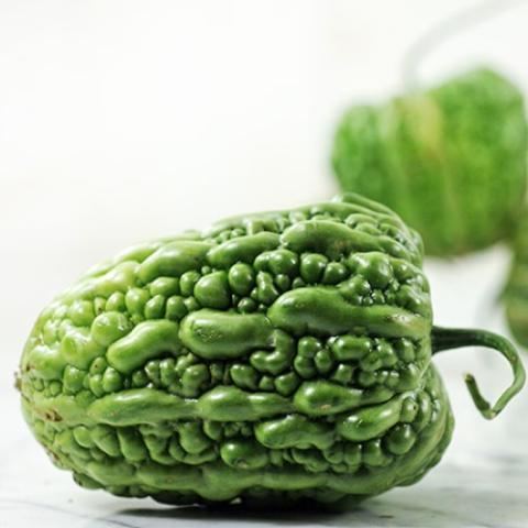 Big Top bitter melon, pepper-shaped bumpy green fruit